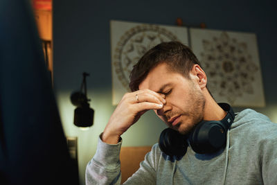 Side view of man using mobile phone