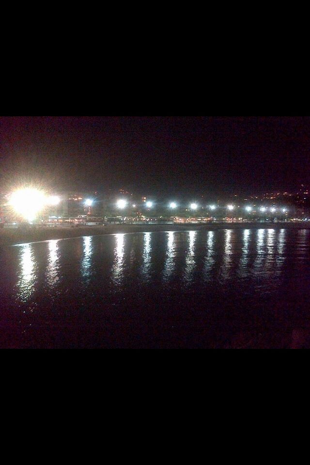 night, illuminated, water, reflection, dark, transfer print, copy space, sea, auto post production filter, waterfront, light - natural phenomenon, sky, no people, light, outdoors, lighting equipment, river, glowing, nature, tranquility