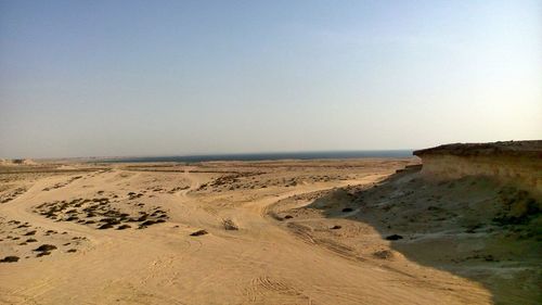 Scenic view of beach against clear sky