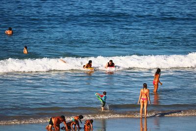 People enjoying at beach