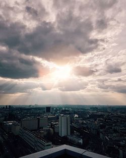 Cityscape against cloudy sky