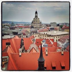 Low angle view of building against cloudy sky