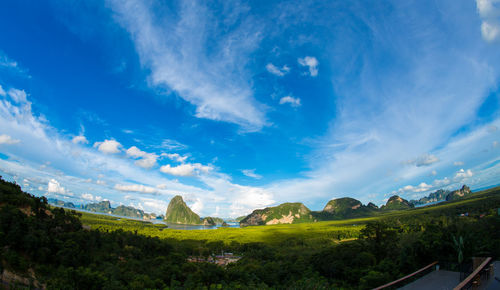 Panoramic view of landscape against blue sky