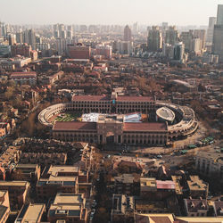 High angle view of buildings in city against sky