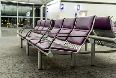 Empty chairs in airport building