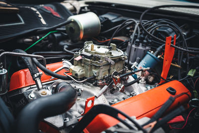 Open engine bay of a classic american sports car with a detailed view of the motor block