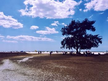 People on landscape against sky