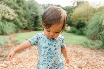 Close-up of girl on field