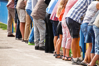 Low section of people standing in row