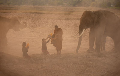 Group of people standing on land