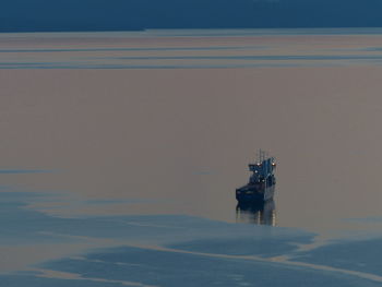 Ship in water against sky