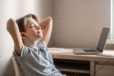 Young woman using laptop at home