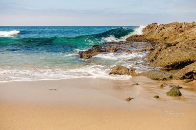 Scenic view of beach against sky