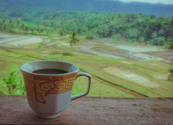 Close-up of coffee cup on table