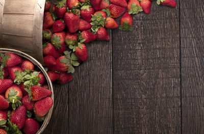 High angle view of strawberries in basket on table