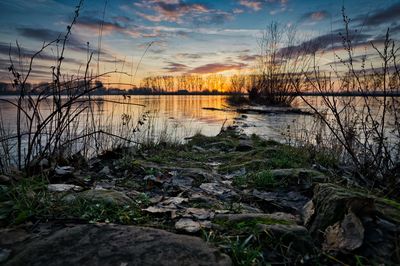 Scenic view of lake against sky during sunset