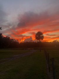 Scenic view of field against sky during sunset