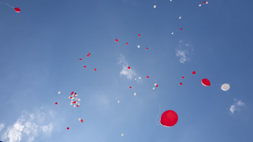 Balloons red and white in the blue sky, zug, switzerland the 13 juni 2021