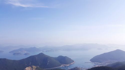 High angle view of mountains and sea against sky