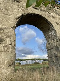 Old ruin on field against sky