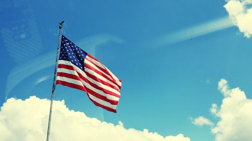 Low angle view of flag against sky