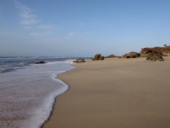 Scenic view of beach against sky