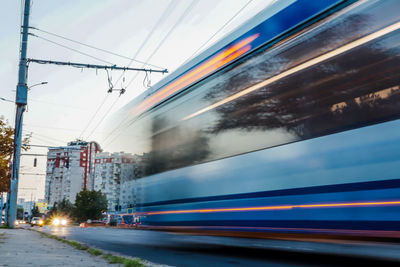 Blurred motion of train at railroad station