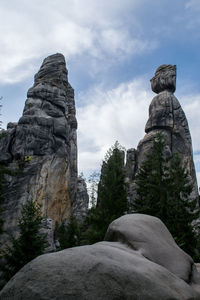 Low angle view of statue against rock formation