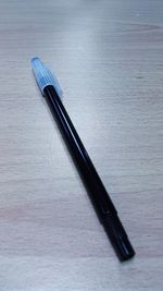 Close-up of pen on table