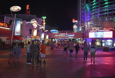 People on street in city at night