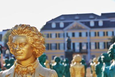 Close-up of statue against building