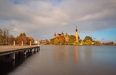 Panoramic view of river and buildings against sky