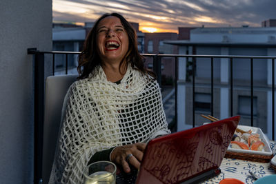 Portrait of young woman using digital tablet