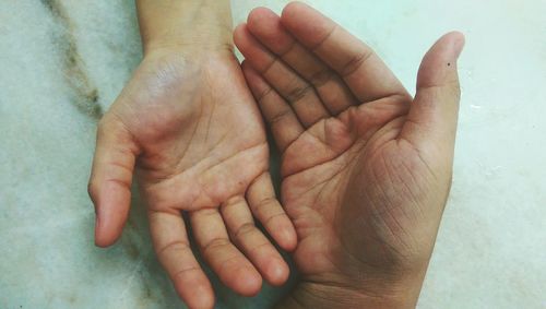 Close-up of baby holding hands