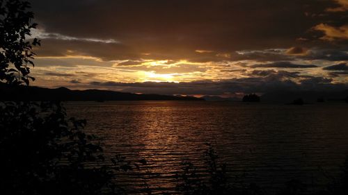 Scenic view of calm sea at sunset