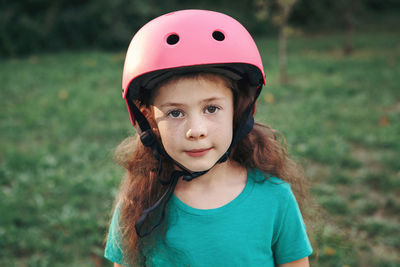 Portrait of cute girl wearing crash helmet