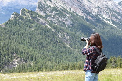 Full length of man photographing on mountain