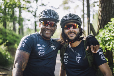 Smiling male cyclist wearing goggles and helmet