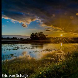 Scenic view of lake at sunset