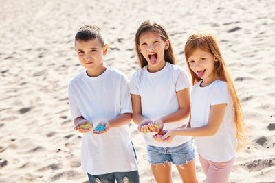 Friends standing at beach