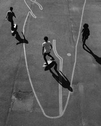 High angle view of men playing basketball