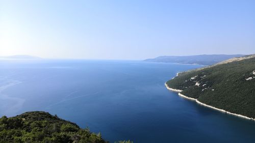 Scenic view of mountains against clear blue sky