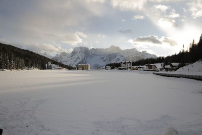 Scenic view of snow covered landscape against sky