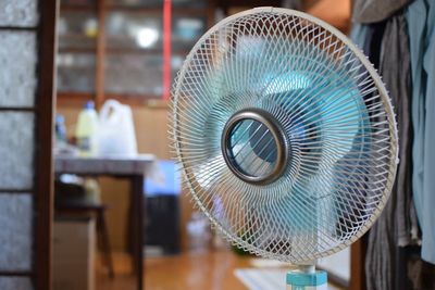 Close-up of electric fan at home