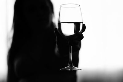 Close-up of woman drinking glass