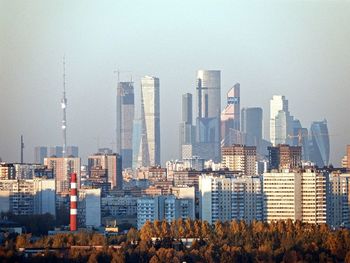 Modern buildings in city against sky