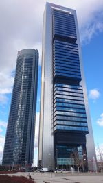 Low angle view of modern buildings against sky