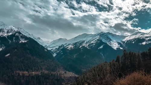 Scenic view of mountains against sky during winter