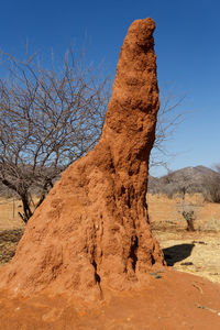 View of rock formation on land against sky