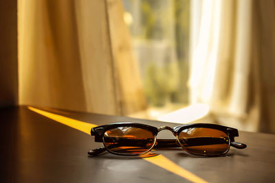 Close-up of sunglasses on table